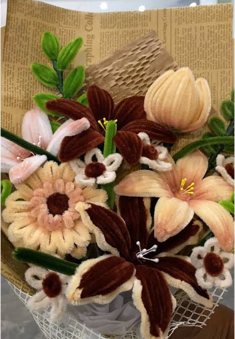 Neutral handcrafted fuzzy-wire bouquet with cream and brown flowers